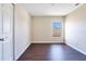 Empty bedroom with wood-look flooring and a window at 15107 Searobbin Dr, Lakewood Ranch, FL 34202