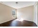 Bedroom with wood-look flooring, a closet, and a bright window at 15107 Searobbin Dr, Lakewood Ranch, FL 34202