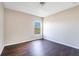 Bedroom with wood-look flooring and a window at 15107 Searobbin Dr, Lakewood Ranch, FL 34202