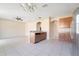 Open-concept kitchen and living room, with stainless steel appliances and tile flooring at 15107 Searobbin Dr, Lakewood Ranch, FL 34202