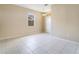 Bright living area featuring tile flooring, natural light from a window, and a welcoming atmosphere at 15107 Searobbin Dr, Lakewood Ranch, FL 34202