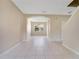 Inviting living area with tile flooring, arched entryway, and neutral walls for versatile styling at 15107 Searobbin Dr, Lakewood Ranch, FL 34202