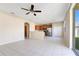 Spacious open concept features tile flooring, stainless steel appliances, and a backyard view at 15107 Searobbin Dr, Lakewood Ranch, FL 34202