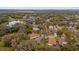 Community aerial view of the neighborhood highlighting the mature trees, pond, and serene residential setting at 2727 Brookville Dr, Valrico, FL 33596