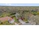 Aerial view of the property featuring a landscaped yard, mature trees, and a tranquil neighborhood setting at 2727 Brookville Dr, Valrico, FL 33596