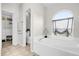 Relaxing bathroom features soaking tub and separate closet at 2727 Brookville Dr, Valrico, FL 33596