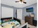 bedroom with a bed, dresser, TV and carpeted floors at 2727 Brookville Dr, Valrico, FL 33596