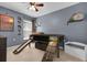 room with blue walls, ceiling fan, bed with slides, and Minecraft decor at 2727 Brookville Dr, Valrico, FL 33596