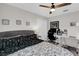 Bedroom with a floral comforter, ceiling fan, and a work space at 2727 Brookville Dr, Valrico, FL 33596