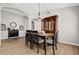 Dining room featuring wood floors, modern lighting, and a classic china cabinet at 2727 Brookville Dr, Valrico, FL 33596