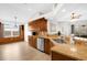 Bright kitchen featuring wooden cabinets, stainless steel appliances, and granite countertops at 2727 Brookville Dr, Valrico, FL 33596