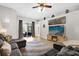 Inviting living area with stylish decor, wood floors, a large TV, and comfortable seating at 2727 Brookville Dr, Valrico, FL 33596