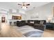 Spacious living room featuring vaulted ceilings, wood floors, an open layout, and comfortable seating at 2727 Brookville Dr, Valrico, FL 33596