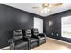Home theater with three recliners and a ceiling fan for a comfortable viewing experience at 2727 Brookville Dr, Valrico, FL 33596