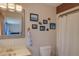 Bathroom with decorative accents above the toilet and vanity at 373 Hile Ln, Punta Gorda, FL 33982