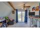 Bright bedroom with vaulted ceilings, exposed beams, and sliding doors to a balcony at 373 Hile Ln, Punta Gorda, FL 33982
