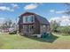 Unique barn style home featuring multi level decks and a large yard at 373 Hile Ln, Punta Gorda, FL 33982