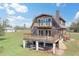 Two-story waterfront home with a large deck and wood siding at 373 Hile Ln, Punta Gorda, FL 33982