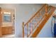 Carpeted staircase with wooden banister leading to the upper level, bathroom is next to the staircase at 373 Hile Ln, Punta Gorda, FL 33982