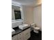 Modern bathroom featuring a square sink, illuminated mirror, and black hexagon tile floor at 501 Knights Run Ave # 2106, Tampa, FL 33602
