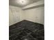 Bright bedroom featuring black marble floors and large double door at 501 Knights Run Ave # 2106, Tampa, FL 33602