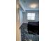 Bedroom showcasing modern tile floor, window with blinds, and contemporary light fixture at 501 Knights Run Ave # 2106, Tampa, FL 33602