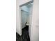 Walk-in closet featuring installed shelving with modern decorative floors, with white chair at 501 Knights Run Ave # 2106, Tampa, FL 33602