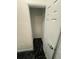 Small storage closet featuring black marble floors and a white door at 501 Knights Run Ave # 2106, Tampa, FL 33602