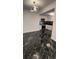 Modern kitchen with black marble floors, stainless steel appliances, and white cabinets at 501 Knights Run Ave # 2106, Tampa, FL 33602