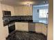 Updated kitchen featuring stainless steel appliances, white cabinets, and mosaic tile backsplash at 501 Knights Run Ave # 2106, Tampa, FL 33602