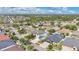 Overhead view of a community displaying mature trees, well-manicured lawns, and houses, providing a peaceful and friendly atmosphere at 7108 Harvest Glen Ln, Riverview, FL 33578