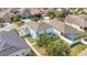 Overhead view of backyard featuring manicured lawn and mature trees, with a white fence, adding to the appeal of the property at 7108 Harvest Glen Ln, Riverview, FL 33578