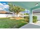 Backyard with green grass, landscaping, and privacy fence at 7108 Harvest Glen Ln, Riverview, FL 33578