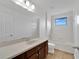 Bright bathroom featuring a large mirror, vanity, tub, and walk-in shower at 7108 Harvest Glen Ln, Riverview, FL 33578