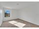 Bright bedroom featuring neutral carpet and a sunlit window at 7108 Harvest Glen Ln, Riverview, FL 33578