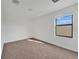 Bright bedroom featuring neutral carpet and a sunlit window at 7108 Harvest Glen Ln, Riverview, FL 33578