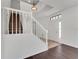 Bright entryway features a staircase with white banisters and a view of the front door at 7108 Harvest Glen Ln, Riverview, FL 33578