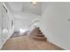 Bright foyer with tile flooring, staircase, and natural light creates a welcoming entrance at 7108 Harvest Glen Ln, Riverview, FL 33578