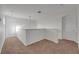 Upstairs landing area with neutral carpet, providing access to multiple rooms at 7108 Harvest Glen Ln, Riverview, FL 33578