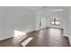 Spacious living room boasts modern flooring and plenty of natural light from the windows at 7108 Harvest Glen Ln, Riverview, FL 33578