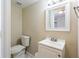 Clean bathroom features a modern vanity, toilet, and neutral color scheme at 8528 Gold Ridge Cir, Tampa, FL 33619