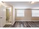 This bedroom features gray plank floors, neutral paint, and a bathroom at 8528 Gold Ridge Cir, Tampa, FL 33619
