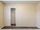 Bedroom featuring gray vinyl floors, neutral paint, and closet with sliding doors at 8528 Gold Ridge Cir, Tampa, FL 33619
