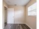 This bedroom has gray wood-look plank floors and neutral paint at 8528 Gold Ridge Cir, Tampa, FL 33619