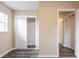 Bedroom featuring neutral paint, window, closet, and gray wood-look plank floors at 8528 Gold Ridge Cir, Tampa, FL 33619
