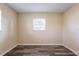 This bedroom has gray wood-look plank floors, neutral paint, and a window at 8528 Gold Ridge Cir, Tampa, FL 33619