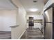 Spacious kitchen with granite countertops, stainless steel appliances, white cabinets, and gray vinyl flooring at 8528 Gold Ridge Cir, Tampa, FL 33619