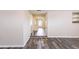 Open-concept living room showcases a seamless transition with wood-look floors at 8528 Gold Ridge Cir, Tampa, FL 33619