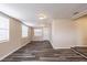 Bright living room featuring wood-look floors, multiple windows, and neutral paint at 8528 Gold Ridge Cir, Tampa, FL 33619