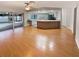 Open floor plan from living room into kitchen, with sliding doors to lanai at 3069 Pin Oak Dr, Clearwater, FL 33759